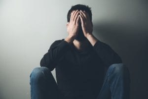 man suffering heroin relapse symptoms