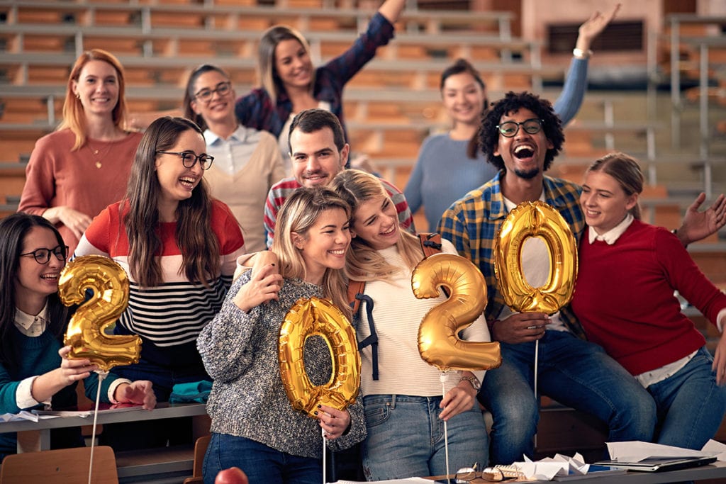 sober new years, smiling students celebrating 2020 new year together in university