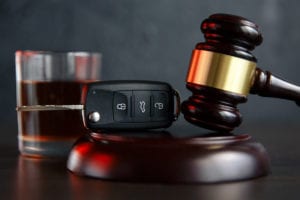 gavel keys and drink represent dui vs dwi