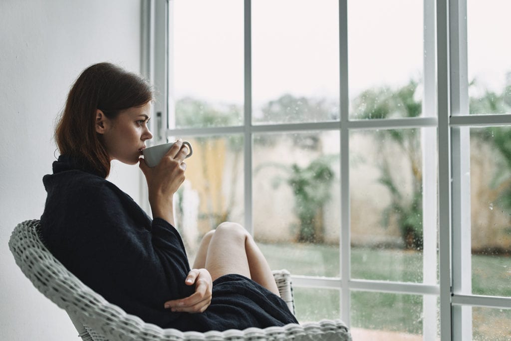 woman drinking coffee thinking about anxiety during a pandemic