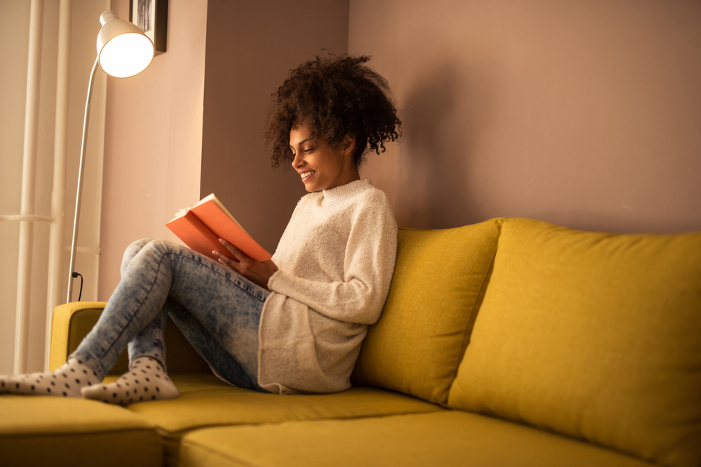 Woman reading her journal for addiction and mental health treatment