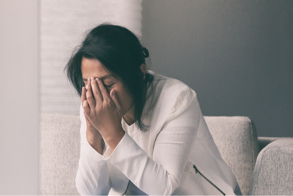 Stressed woman, wondering "What is a mental breakdown?"