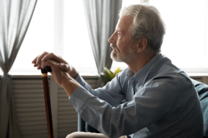 Old person near window, thinking about wet brain syndrome
