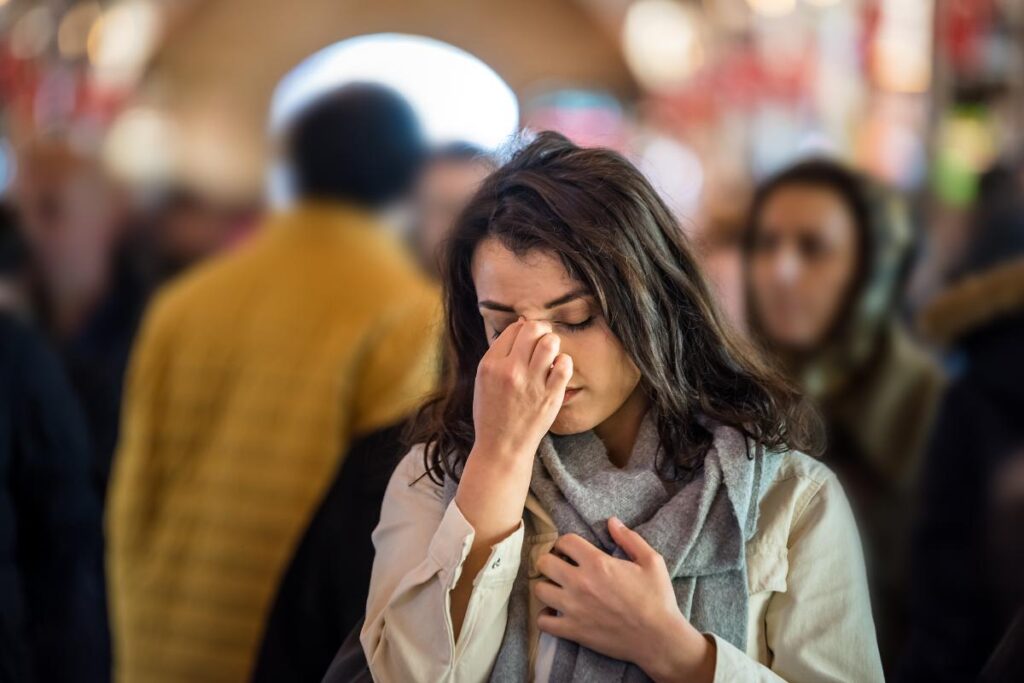 Person feeling down as they learn what the difference is between mental health and emotional health