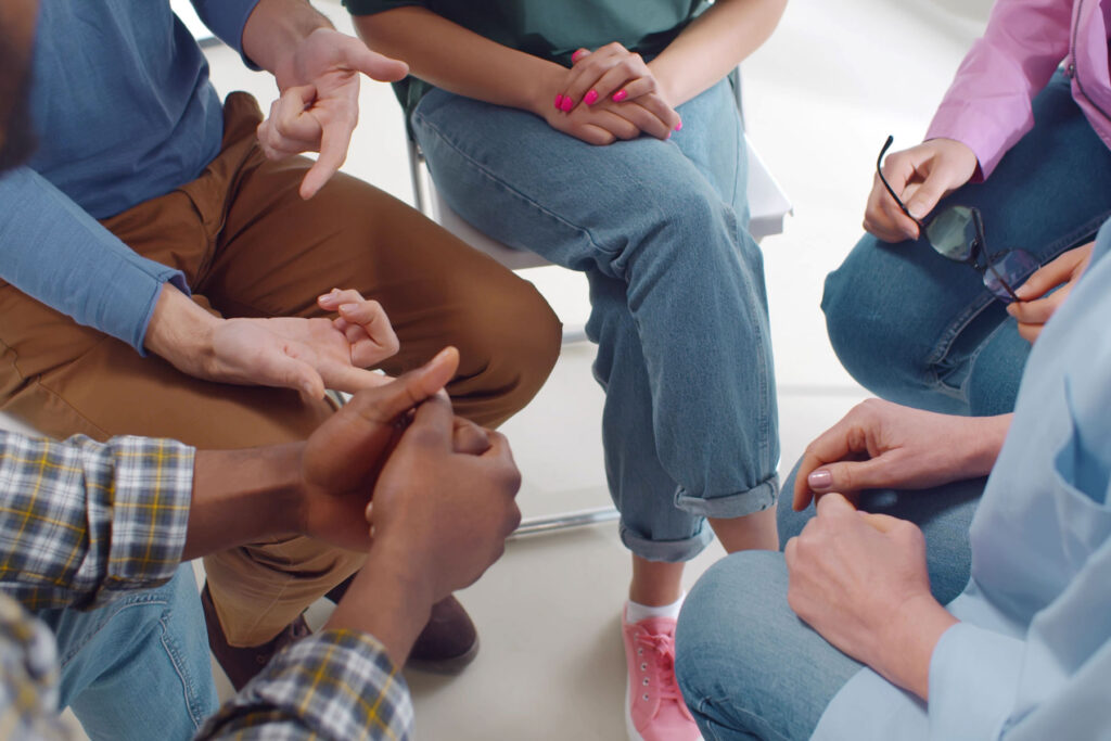 Hands of people in inpatient treatment