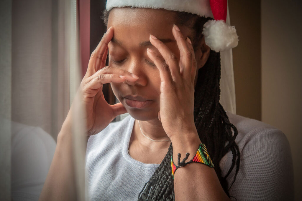 Person feeling holiday anxiety