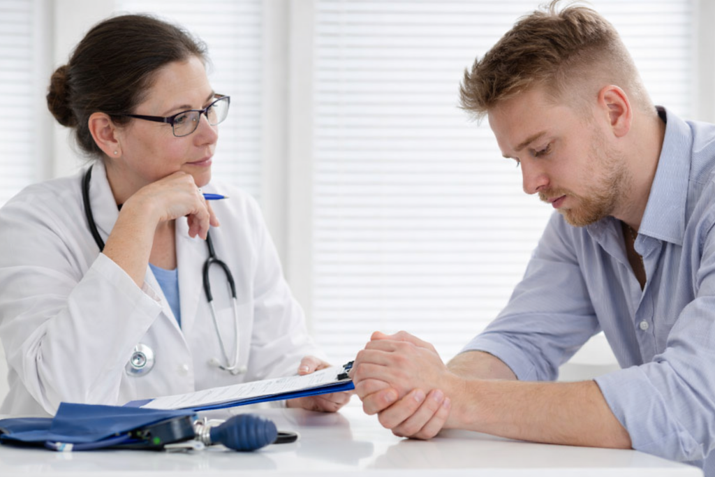 man struggling with substance ubuse consulting with a physician